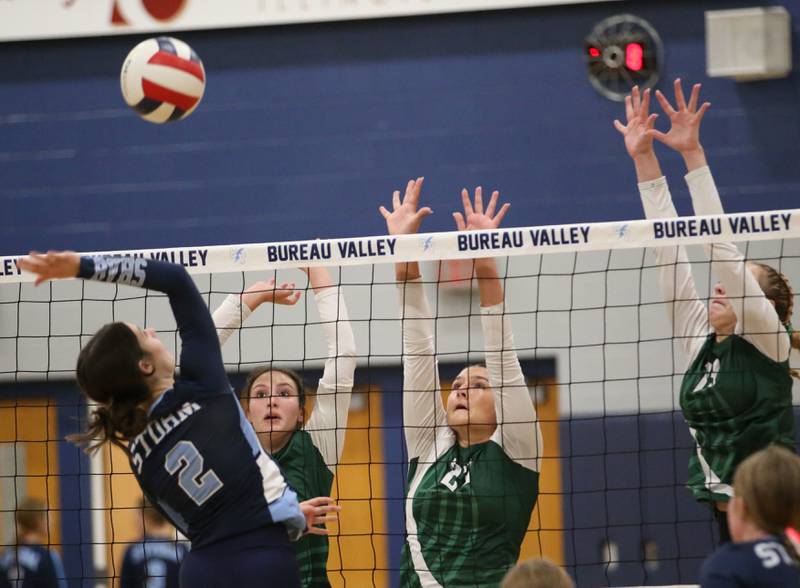 Bureau Valley's Matalyn Michlig spikes the ball past St. Bede's Aubree Acuncius, Ali Bosnich and Ashlyn Erm on Tuesday, Sept. 5, 2023 at Bureau Valley High School.