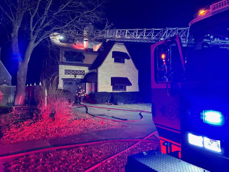 Firefighters putting out a fire at a residence on Monday in the 600 block of  Cornelia Street.