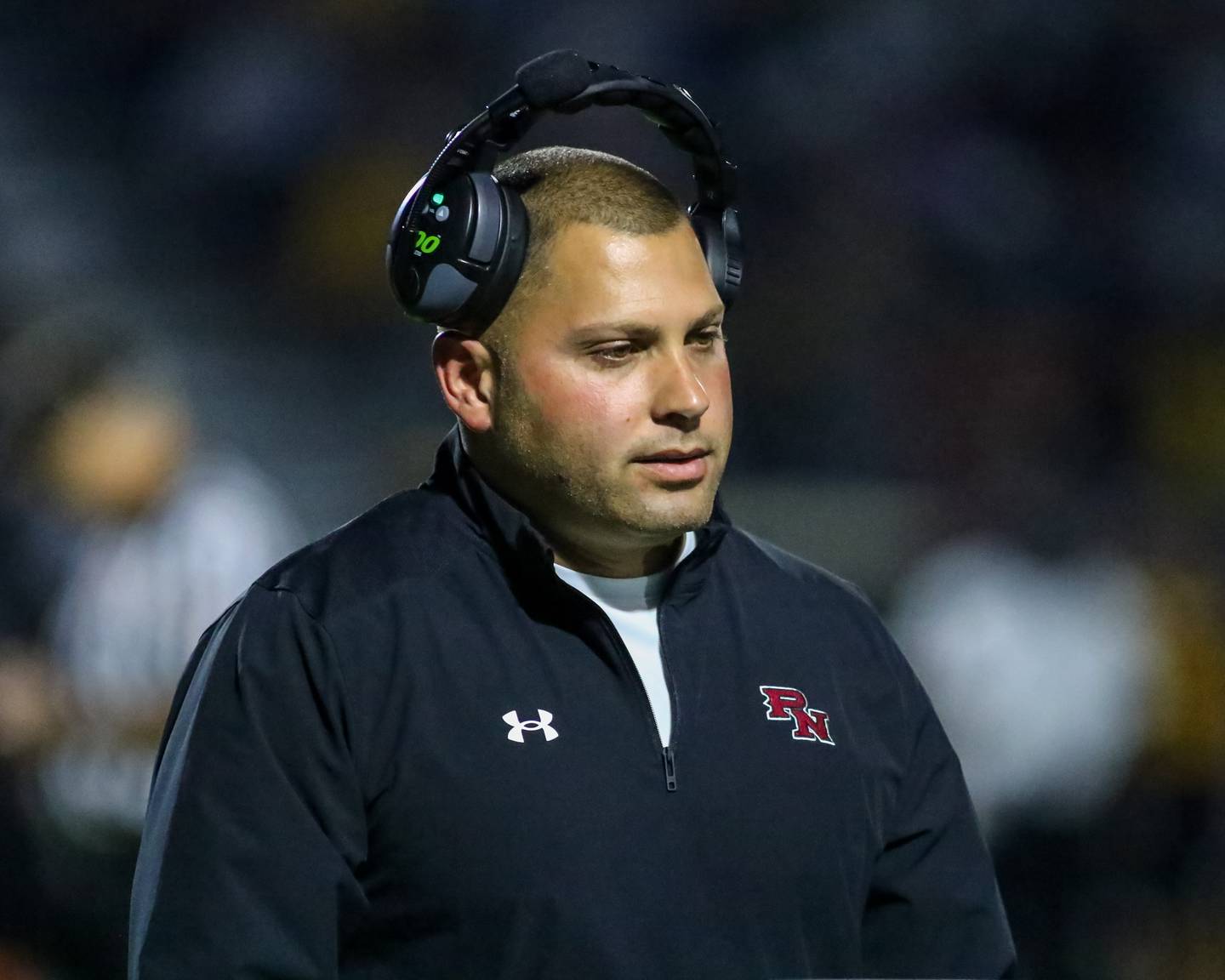 Plainfield North's head coach Anthony Imbordino leaves the field after speaking with the refs during football game between Plainfield North at Joliet West.  Sept 15, 2023.