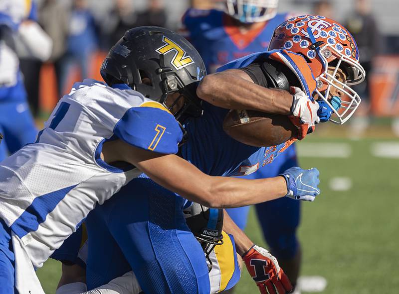 St. Teresa’s Jeremy Walker is hauled down from behind by Tri-Valley’s Nicholas Traugott in the class 2A IHSA football state championship game Friday, Nov. 25, 2022.