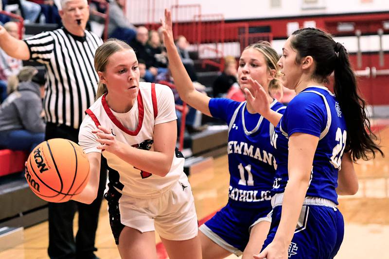EP's Lauren Punke passing around Newman's Brooklyn Smith and Anna Propheter in Erie on Thursday, Dec. 11, 2025.