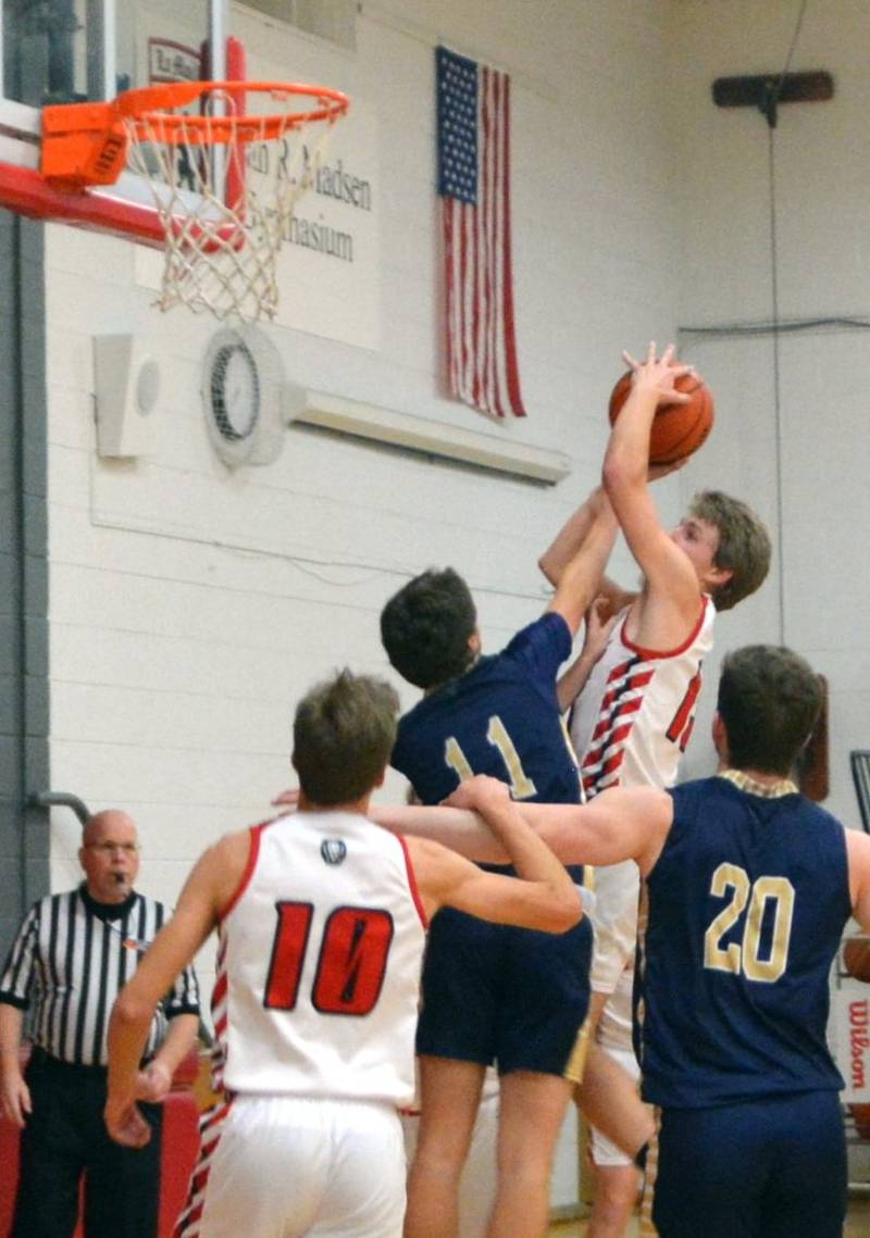 LaMoille junior Josh Martin shoots against Hiawatha Wednesday night at Dean Madsen Gymnasium. He scored 21 points to lead the Lions to a 62-54 victory