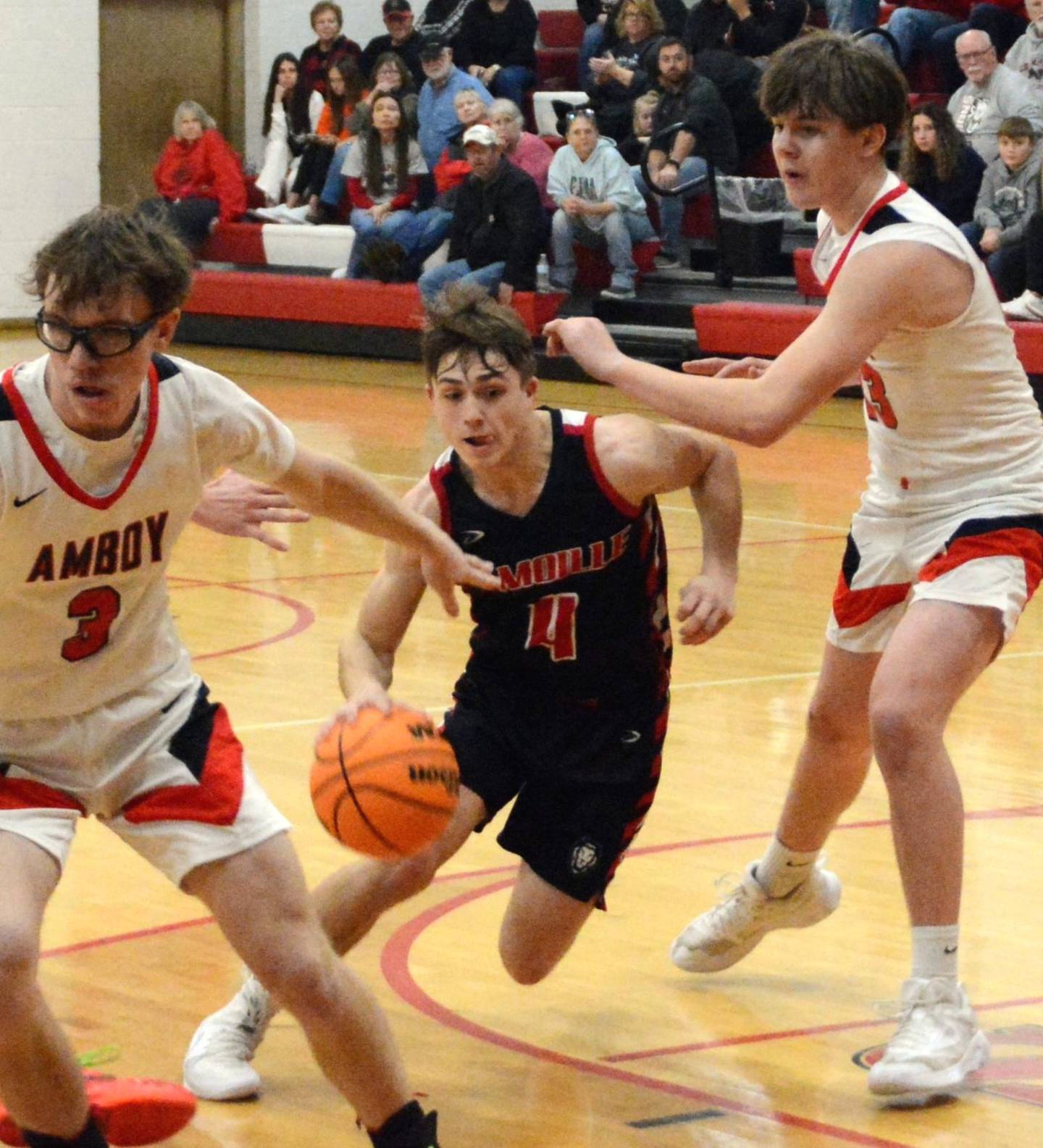 LaMoille's Ed Fry drives against Amboy in Saturday's third-place game of the LaMoille Holiday Classic. The Clippers won 55-45.