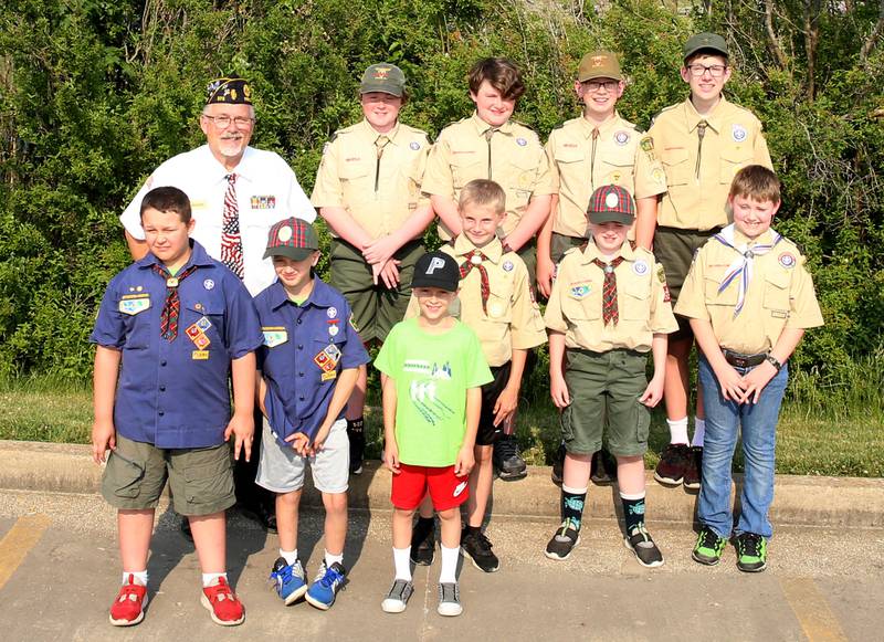 Peru Veterans Memorial Group commander Dennis Znaniecki poses with Boy Scout Troop 123 and Cub Scout 3709 from Peru during a Flag Burning Ceremony on Wednesday, June 14, 2023 in Peru.