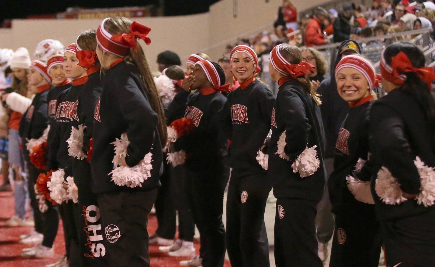 Ottawa cheerleaders smile on the sidelines during the game against L-P on Friday, Oct. 6, 2023 at Howard Fellows Stadium.