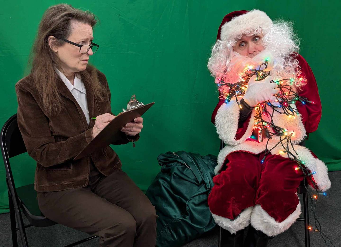 [Santa Therapy] Dr. Christmas (Debbie Roberts) lends a therapeutic ear to Santa Claus (Danny Glenn) in "Seasonal Lights" from WT Productions [photo credit: Carl Zeitler] 2024