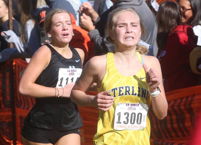 Nazareth's Sara Owen and Sterling's Laney Zuithoff compete in the Class 2A State Cross Country race on Saturday, Nov. 4, 2023 at Detweiller Park in Peoria.