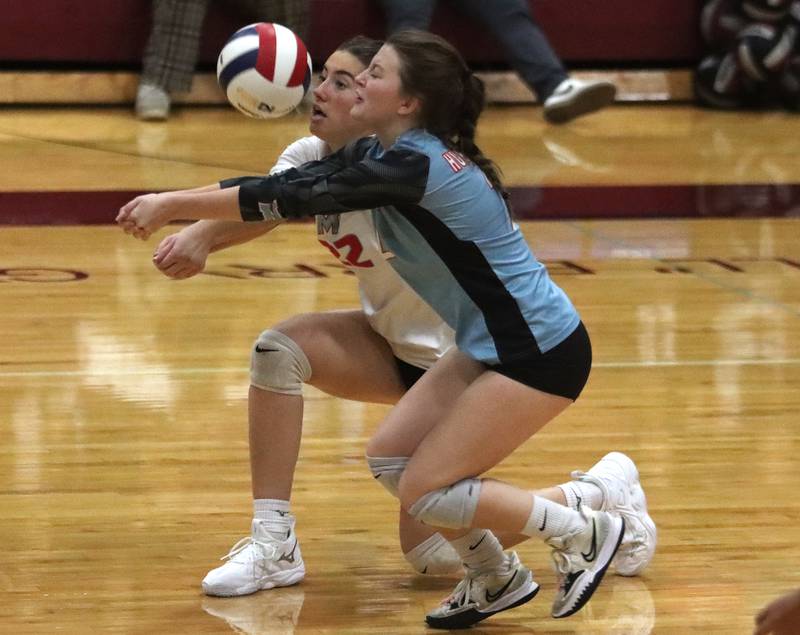 Marian Central’s Jilly Winkelman, front, and Hadley Rogge find the ball against Marengo in IHSA Class 2A Regional volleyball action on Monday, Oct. 28, 2024, at  Marengo High School  in Marengo.