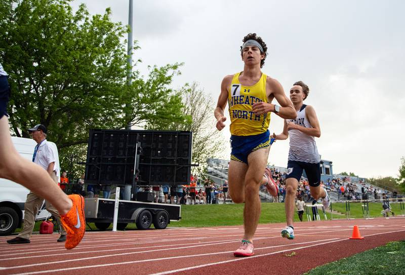 Wheaton North’s Jack Sanders races around the track during the varsity 3200 meter race at the Dukane Conference Boys Track and Field Meet hosted by Lake Park High School in Roselle on Friday, May 16, 2025. Sanders placed 8th.