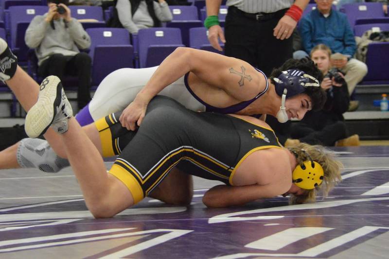Rochelle's Roman Villalobos (top) gets the upper hand on his opponent during a dual meet on Jan. 21, 2026.