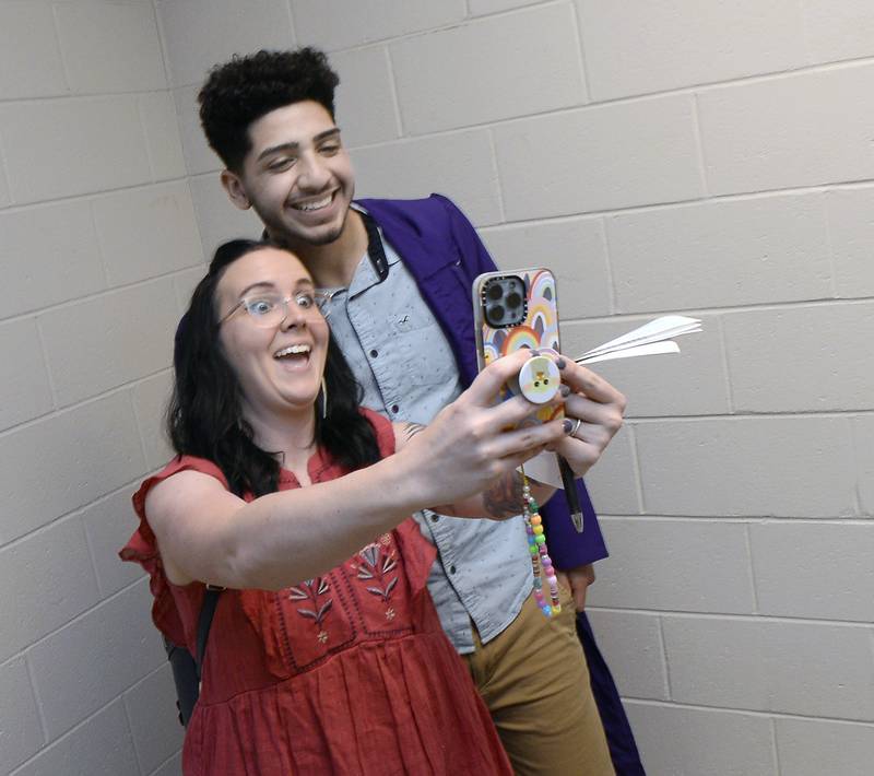 Mendota High School teacher Kristi Barajas takes a selfie of her and graduate Elian Quijas prior to the high school's graduation ceremony Saturday, May 14, 2022.