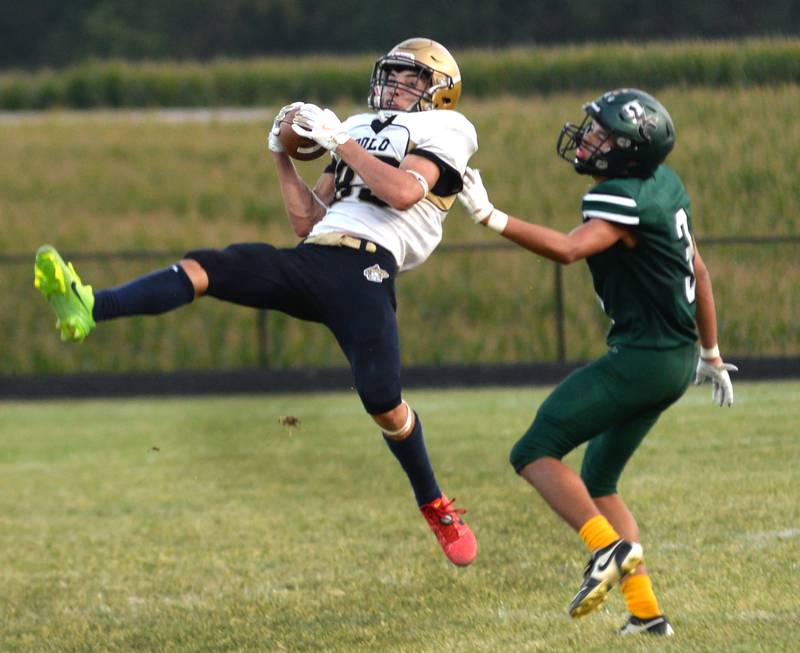 Polo's Mercer Mumford (83) catches the ball against West Carroll in 8-man football action in Mt. Carroll on Friday, Sept. 12, 2025.