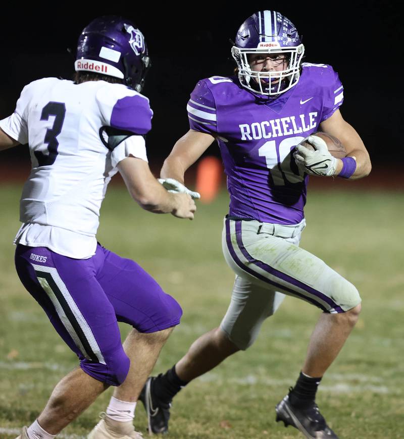 Rochelle's Garrett Gensler tries to get by Dixon’s Ryan Ramsdell during their first round playoff game Friday, Oct. 28, 2022, at Rochelle High School.