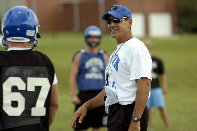 Geneva head coach Rob Wicinski jokes with his team after a break in practice in 2009. Wicinski will be inducted into the Illinois High School Football Coaches Association Hall of Fame today.