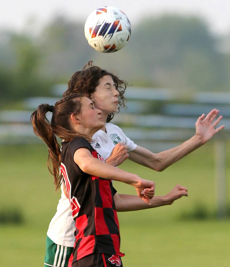 Indian Creek's Emma Turner and Alleman's Gretchen Ellis go for a header during their Class 1A sectional final game Friday, May 19, 2023, at Hinckley-Big Rock High School.