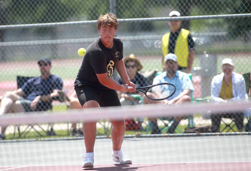 Sycamore’s Jonathan Locascio returns the ball during a doubles match with partner Joe Culotta (not pictured) in the state championship preliminaries at Palatine High School on Thursday, May 23, 2024.