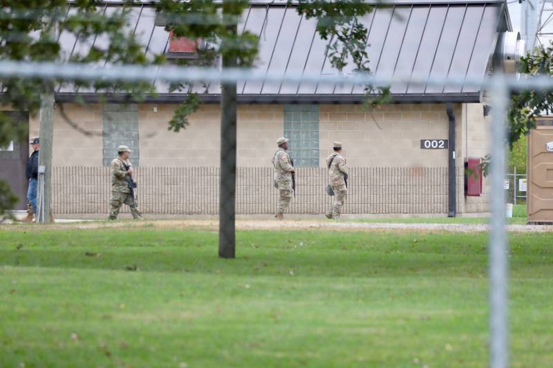 Soldiers walk the grounds of the  Joliet Local Training Area site for the Illinois National Guard at 20612 Arsenal Road in Elwood on Tuesday, Oct. 7, 2025.
