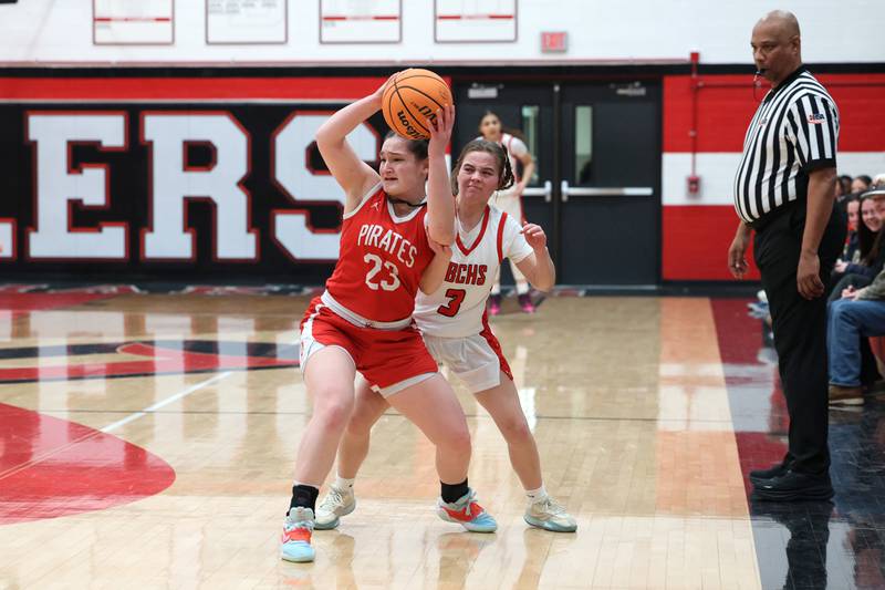 Ottawa's Mary Stisser looks to pass under pressure from Bradley-Bourbonnais' Katie McBurnie during Ottawa's 55-44 victory on Monday, Feb. 9, 2026.