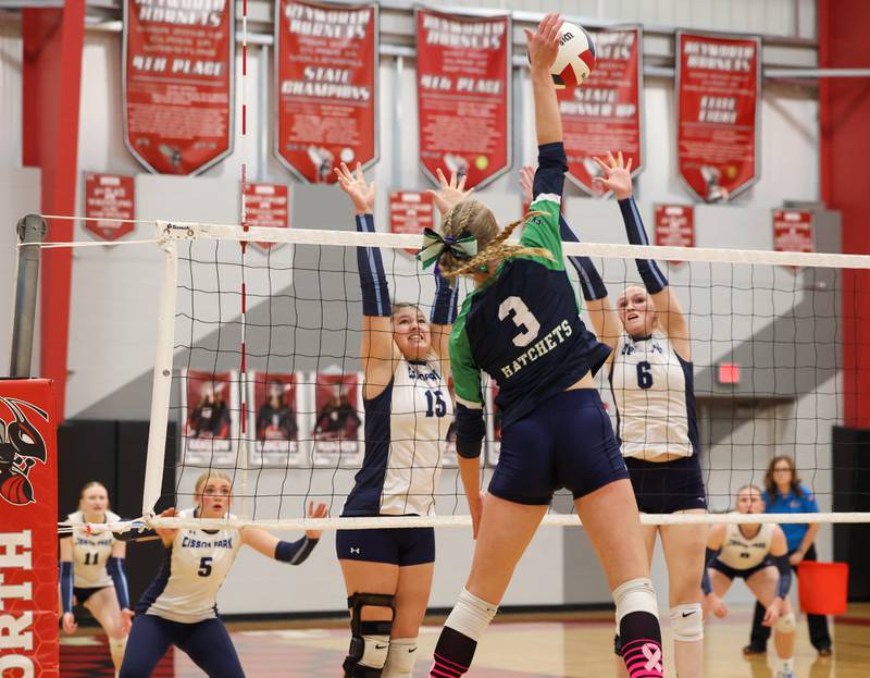 Cissna Park's Ava Henrichs, left, and Marina Day jump to block a hit during the Timberwolves' victory in two sets, 25-22, 25-11, over Windsor/Stewardson-Strasburg in the IHSA Class 1A Heyworth Super-Sectional on Monday, Nov. 10, 2025.