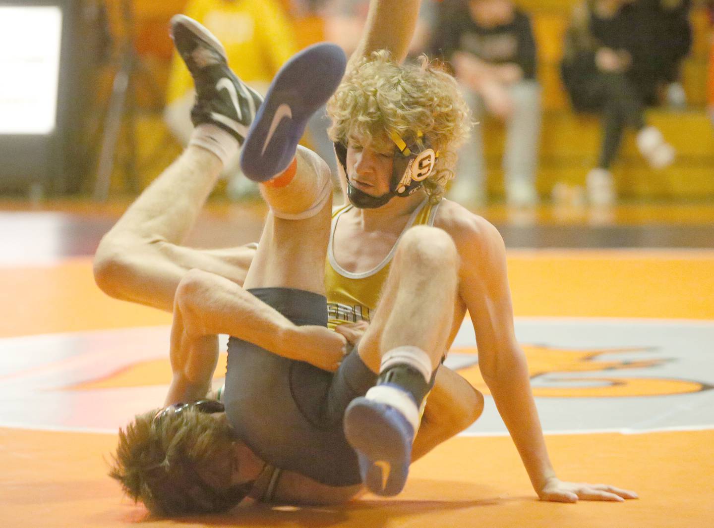 Sterling's Zyan Westbrook wrestles Geneseo's Devan Hornback in the 132 weight class during the Class 2A Sectional championship on Saturday, Feb. 15, 2025 at Washington High School.