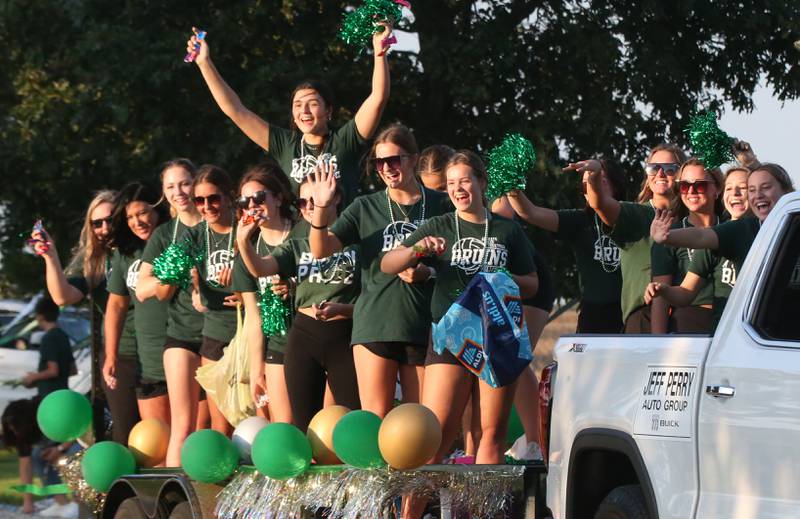 Members of the St. Bede volleyball team ride in the St. Bede Homecoming Parade on Friday, Sept. 29, 2023 at St. Bede Lane.