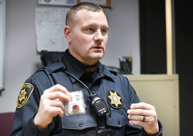 DeKalb County sheriff’s deputy Doug Brouwer talks Friday, March 22, 2024, at the Sheriff’s Office in Sycamore, about Narcan opioid overdose treatment spray and how it is administered to patients.