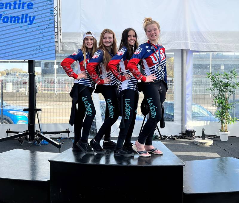 Team Volare members (from left) Bella Capra, Jill Knutson, Gianna Keuer and Kiana Adamson pose after receiving their silver medals in the 4-Way Dynamic junior event at the 4th FAI World Cup of Indoor Skydiving in Charleroi, Belgium.