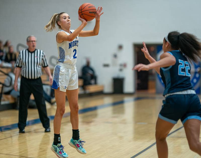 St.Charles North's Reagan Sipla (2) shoots a three-pointer against Lake Park during a basketball game at St.Charles East High School on Wednesday, Dec 21, 2022.