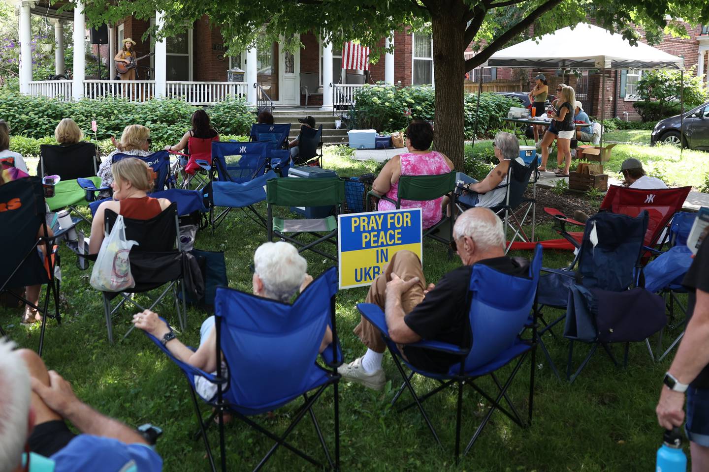 Music lovers pack the lawn along Western Avenue to listen to Any Jones perform. The Upper Bluff Historic District hosted Porch & Park Music Fest featuring a variety of musical artist at five different locations. Saturday, July 30, 2022 in Joliet.