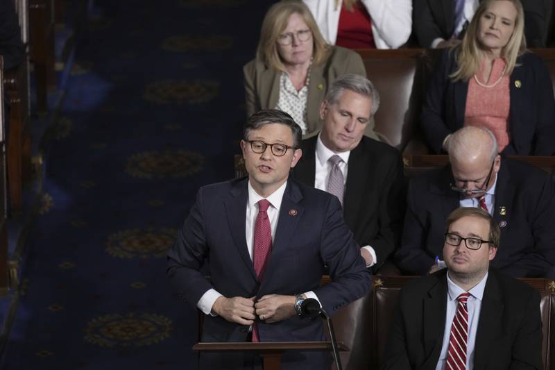 Rep. Mike Johnson, R-La., stands to vote for himself for speaker, as House Republicans try to elect a speaker, at the Capitol in Washington, Wednesday, Oct. 25, 2023. (AP Photo/J. Scott Applewhite)