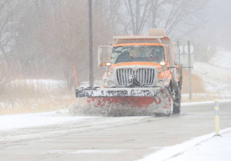 A snow plow moves snow off of Illinois Route 71 on Monday, March 16, 2026 south of Oglesby.