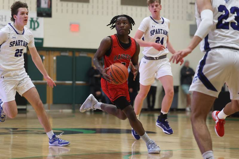 Bolingbrook’s DJ Strong looks for a play against St. Francis in the Jack Tosh 2023 Holiday Classic on Wednesday, Dec.27th, 2023 in York.