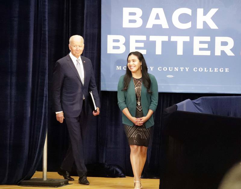 President Joe Biden walks in with Edith Sanchez, the McHenry County College student trustee for the 2021-22 school year, before speaking Wednesday, July 7, 2021, at McHenry County College in Crystal Lake.
