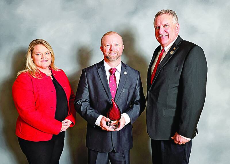 Bureau County Farm Bureau won the Group IV New Horizon Award for the work on the Community Impact Grant. L-R: Jill Frueh, Bureau County Farm Bureau Executive Director, Evan Hultine, Bureau County Farm Bureau President and Brian Duncan, Illinois Farm Bureau Vice President.