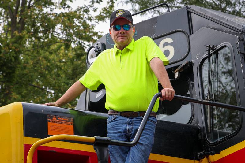 Tom Meierhoff of IAIS Railroad stands by train engine on Saturday, September 28, 2024 at the railroad tracks in Bureau.