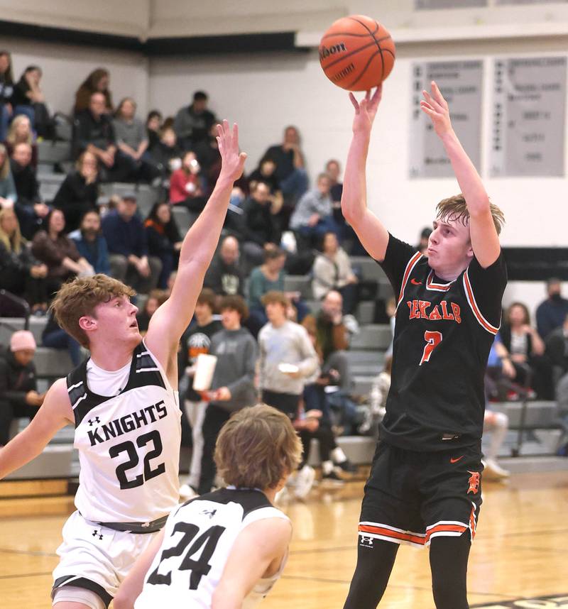 DeKalb's Sean Reynolds shoots over Kaneland's Johnny Spallasso during their game Tuesday, Jan. 24, 2023, at Kaneland High School.