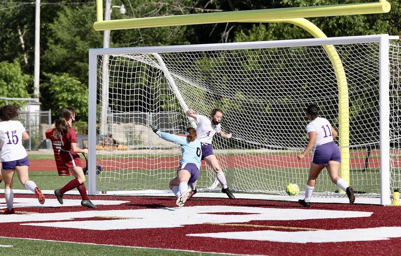 Morris' Ella McDaniel scores past Plano goalie Ryen Foote and defenders Molly Herbig (4) and Itzel Benitez (11) Tuesday, June 1, 2021, in Morris' 8-0 win.