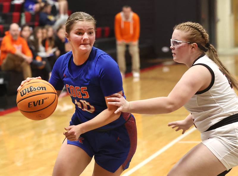 Genoa-Kingston's Arielle Rich drives by Indian Creek's Taylor Hulmes Monday, Dec. 8, 2025, during their game at Indian Creek High School in Shabbona.