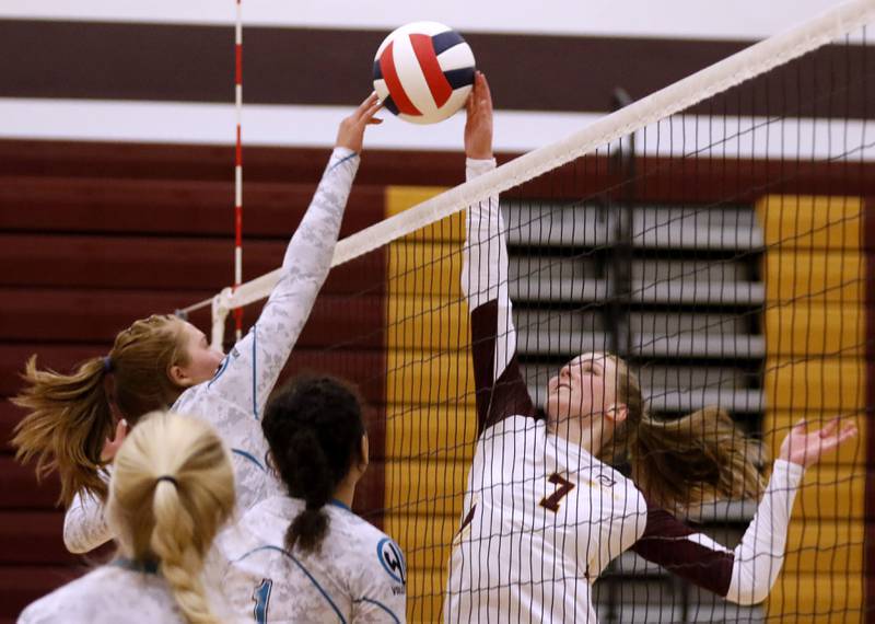 Woodstock North's Makenzie Buss and Richmond-Burton's Alexandra Hopp hit the ball during a Kishwaukee River Conference volleyball match Wednesday, Sept. 14, 2022, between Richmond-Burton and Woodstock North at Richmond-Burton Community High School.