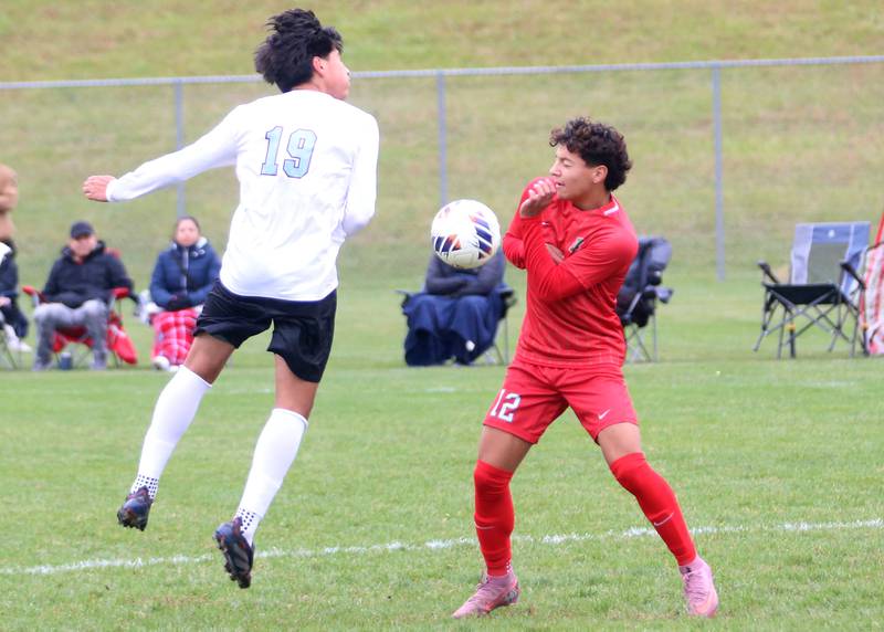 Kankakee's Luisangel Pereda knocks the ball down as L-P's Adan Pantoja defends during the Class 2A Regional title game on Saturday, Oct. 25, 2025 at Ottawa High School.