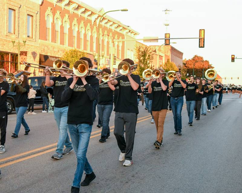 Sycamore High School’s Spartan marching band performs on Wednesday, Oct. 8, 2025, during the Homecoming parade downtown.