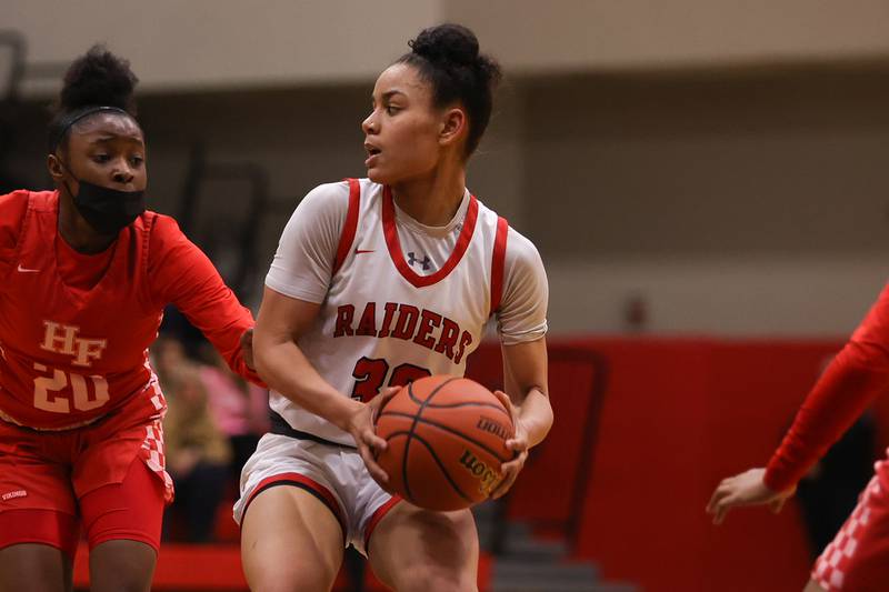 Bolingbrook’s Angelina Smith looks for a play against Homewood-Flossmoor in the Class 4A Bolingbrook Sectional championship. Thursday, Feb. 24, 2022, in Bolingbrook.