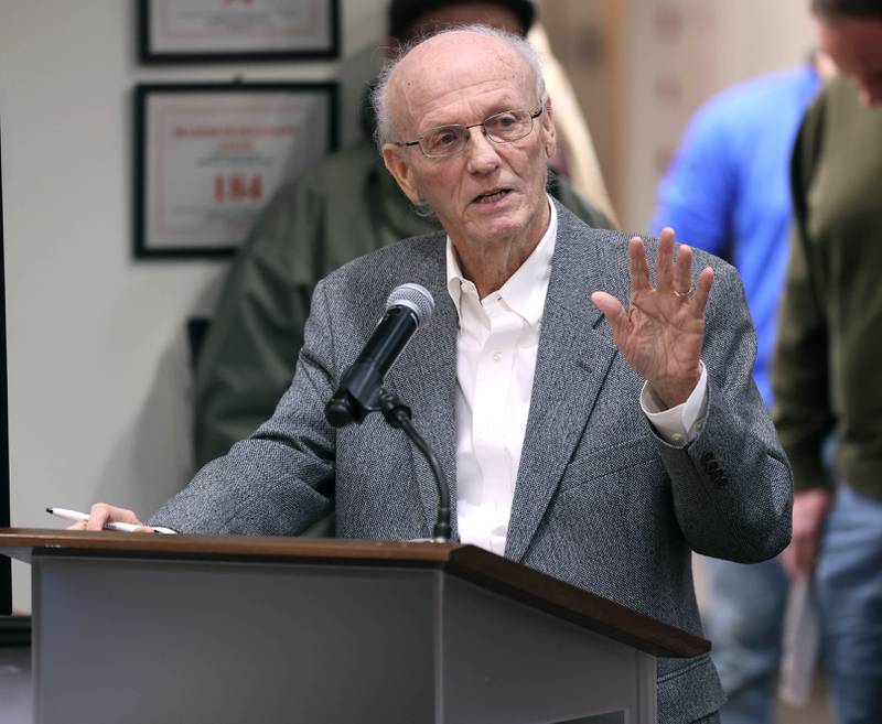 Russell Burns, former DeKalb city attorney speaks Monday, Dec. 1, 2025, during public comment, about the proposed 560-acre Endeavour Energy data center at the Planning and Zoning Commission hearing at the DeKalb Public Library.