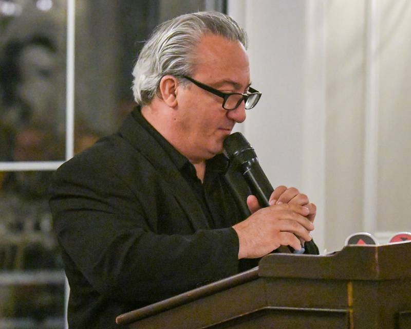 Rich Onesti speaks about his brother Ron Onesti, a Charlemagne nominee, during the St. Charles Area Chamber of Commerce's awards dinner on Friday May 1, 2026, held at Royal Fox Country Club in St. Charles.