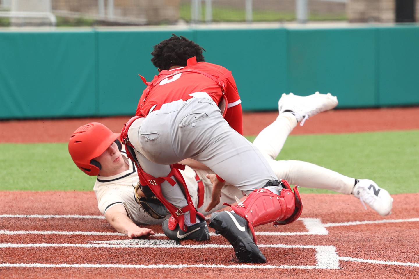 Bradley-Bourbonnais' Andrew Kubal nearly beats the tag at home during the Boilermakers' 8-7 loss to Homewood-Flossmoor on Monday, April 13, 2026.