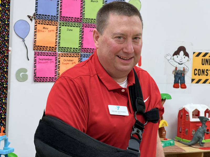On Friday, April 28, 2023 the new Chief Executive Officer of Kishwaukee Family YMCA Brian Bickner smiles while talking to children in a preschool class hosted inside the facility.