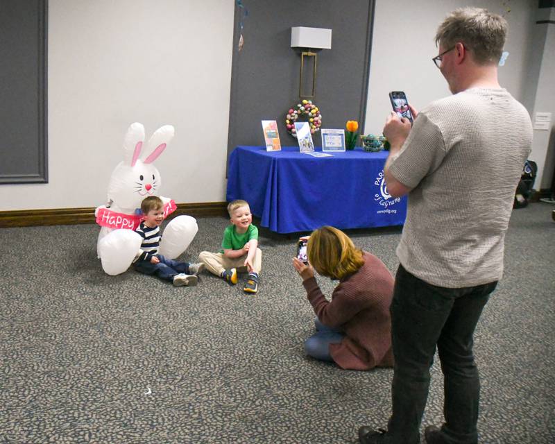 Ryan Summers, right, takes a photo of his kids, Calvin Summers, 3, and Finn Summers, 4, along with grandma Debra Summers on Saturday March 29, 2025, during the breakfast with the bunny event held at the La Grange Park District Recreation Center.