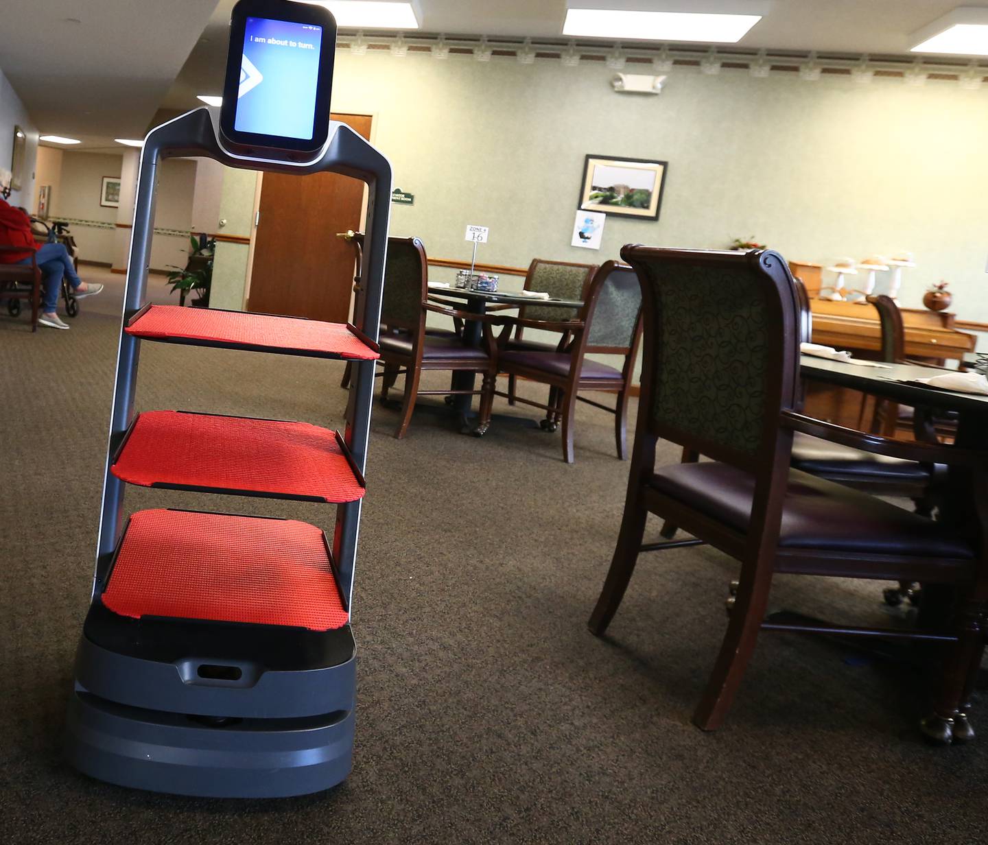 Rosie the new high-tech robot makes a left turn into the dining area at Heritage Woods on Tuesday Jan. 11, 2022 in Ottawa.