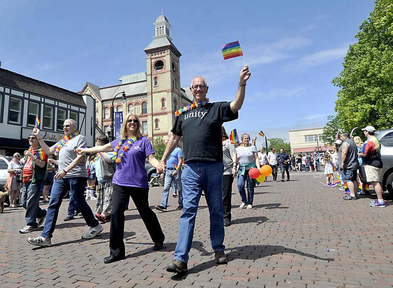 People march Sunday, June 9, 2019, around the Woodstock historic Square during the  Woodstock Pride Fest Parade. The new festival celebrated Lesbian, Gay, Bisexual and Transgender Pride Month.
