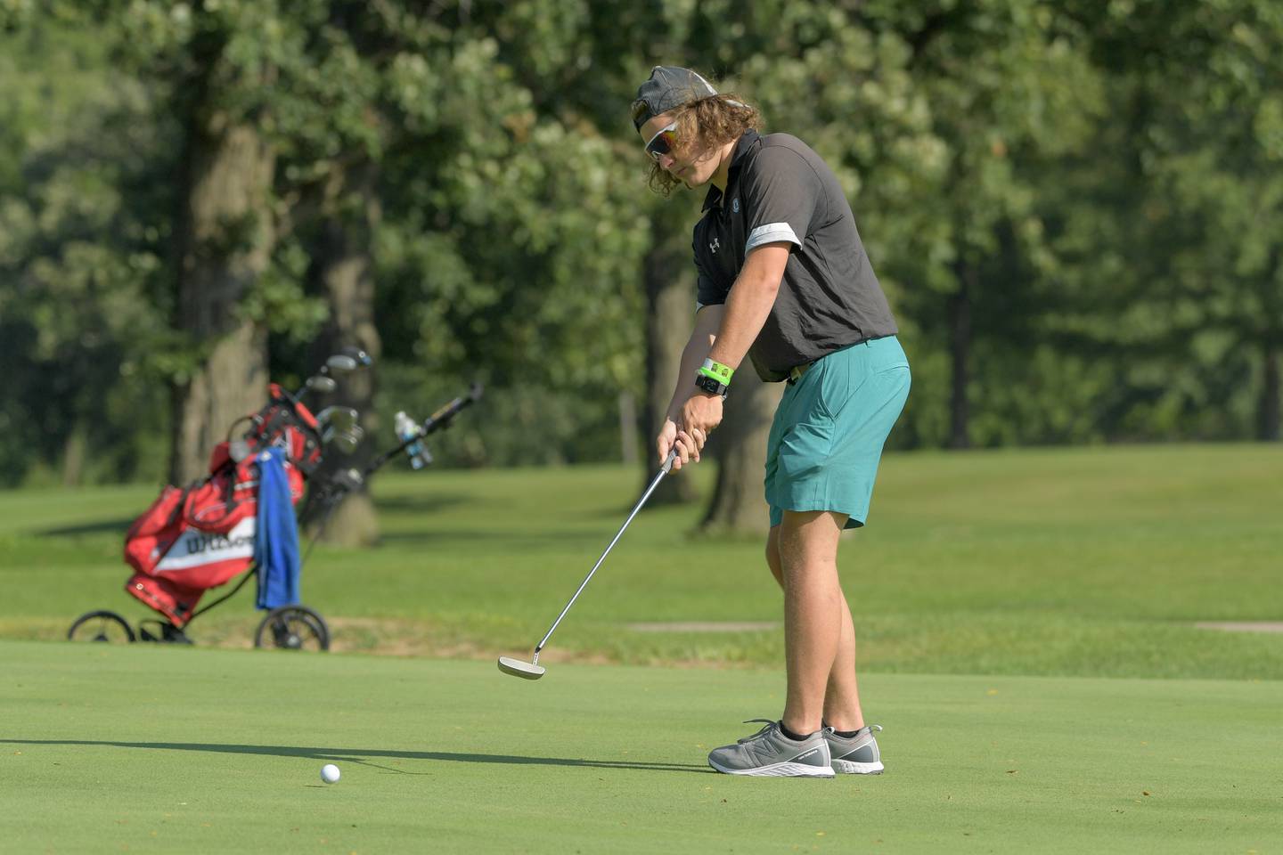 Hinckley-Big Rock's Saje Beane putts during golf at Indian Oak Golf Course in Shabbona on Tuesday, Aug. 15, 2023.